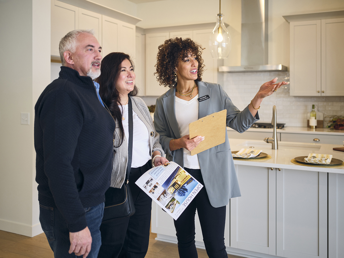 Real Estate Agent Showing a New Home to Prospective Buyers